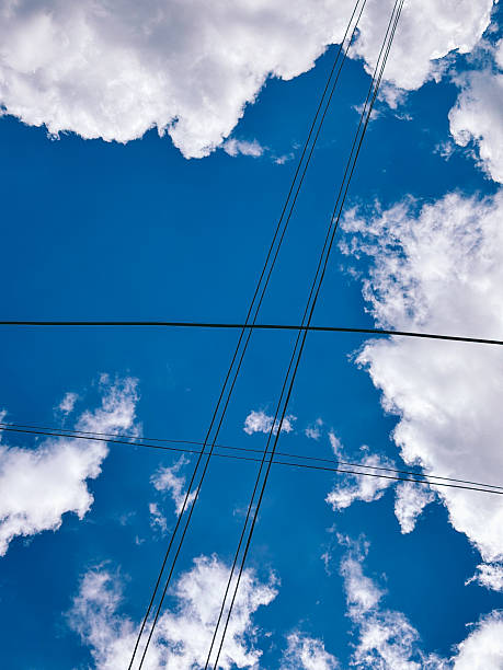 istock Geometric Pattern of Electrical Wires Against a Cloudy Sky 2228450749