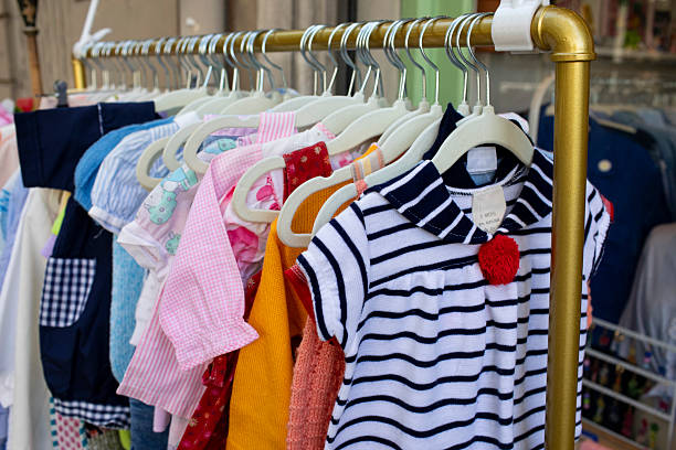 istock Used children's clothes on a clothes rail 2228451183