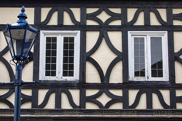 Hastings, East Sussex, UK - 22nd June 2025.\nAn old house with a timber-framed construction and stained glass windows, characteristic of Tudor architecture.