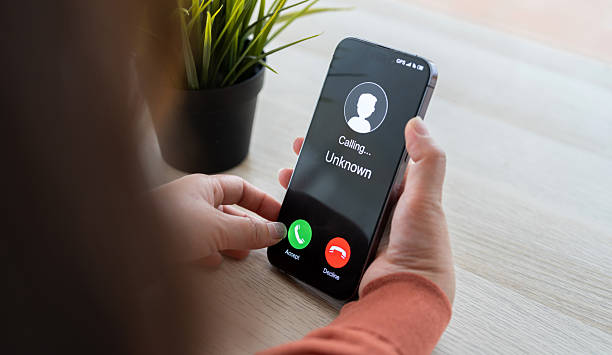 istock Phone scam alert with hacker and scammer calling unknown number, cybercrime, data theft, phishing attempt, fraud alert, digital security threat, cyber attack warning technology and crime concept 2228455641