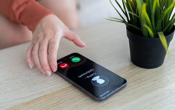 istock Phone scam alert with hacker and scammer calling unknown number, cybercrime, data theft, phishing attempt, fraud alert, digital security threat, cyber attack warning technology and crime concept 2228455643