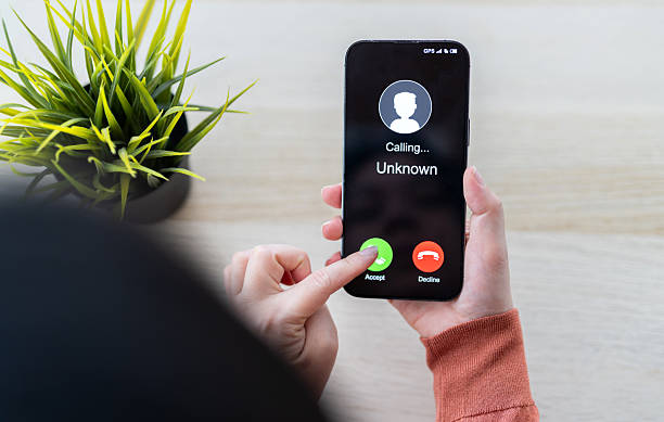 istock Phone scam alert with hacker and scammer calling unknown number, cybercrime, data theft, phishing attempt, fraud alert, digital security threat, cyber attack warning technology and crime concept 2228455652