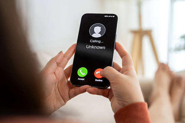 istock Phone scam alert with hacker and scammer calling unknown number, cybercrime, data theft, phishing attempt, fraud alert, digital security threat, cyber attack warning technology and crime concept 2228455653