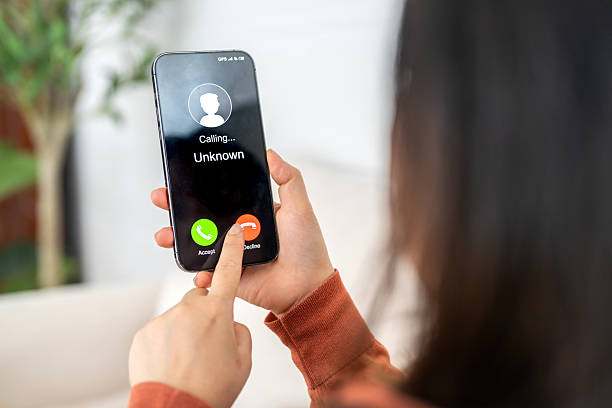 istock Phone scam alert with hacker and scammer calling unknown number, cybercrime, data theft, phishing attempt, fraud alert, digital security threat, cyber attack warning technology and crime concept 2228455655