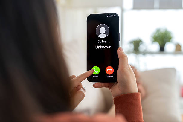 istock Phone scam alert with hacker and scammer calling unknown number, cybercrime, data theft, phishing attempt, fraud alert, digital security threat, cyber attack warning technology and crime concept 2228455656