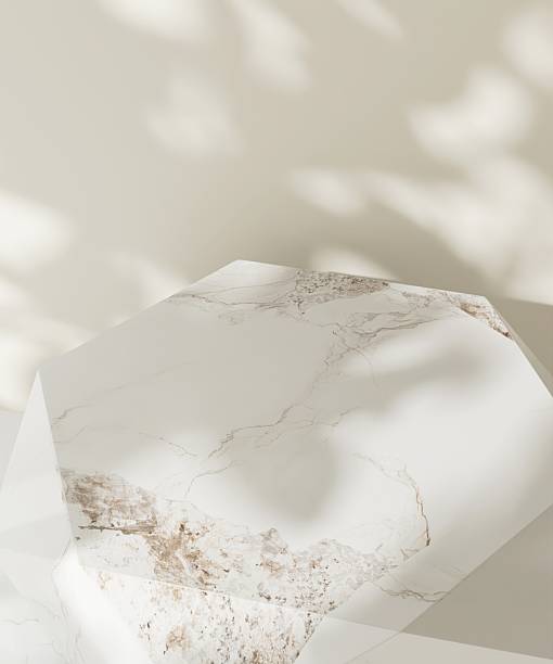 High angle of white modern, minimal marble dodecahedron podium table in dappled sunlight, on cream wall for luxury, elegant fashion, beauty, cosmetic, skincare, body care product display background 3D