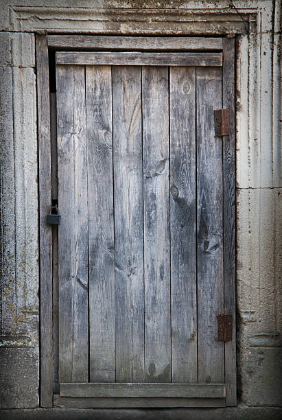 istock old wooden door in a stone wall 2228460715