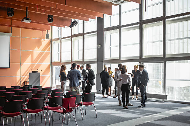 istock Diverse Business Executives Networking at Modern Conference Venue 2228461900
