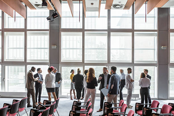 istock Diverse Business Executives Networking at Modern Conference Venue 2228461918