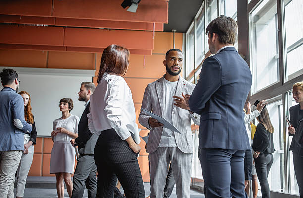 istock Diverse Business Executives Engaging in Professional Networking at Conference 2228461925