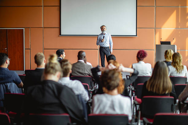 istock Speaker Presenting to Engaged Audience at Business Conference 2228461949