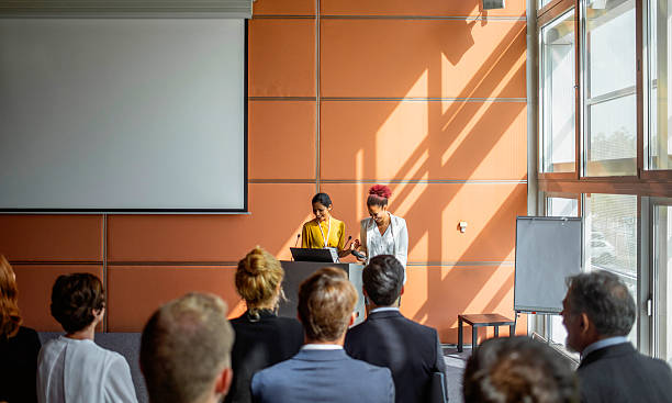 istock Business Professionals Presenting at a Conference With Engaged Audience 2228461952