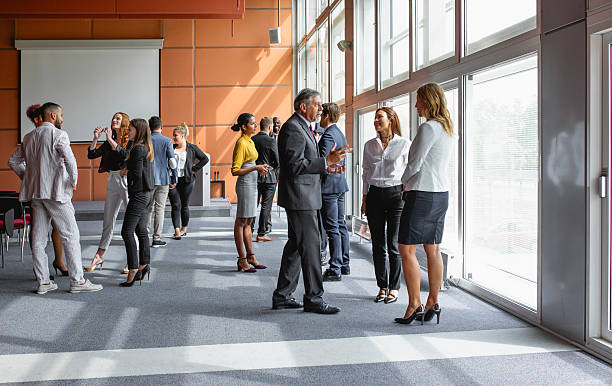 istock Diverse Business Executives Gathering for a Business Conference Networking Session 2228461993