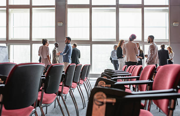 istock Diverse Business Executives Networking at a Conference Venue 2228461997