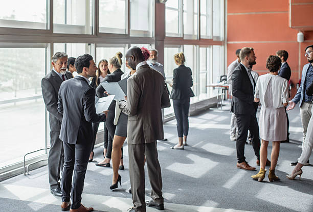 istock Diverse Business Executives Engaging in Discussions at a Conference 2228462005