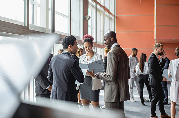 istock Diverse Business Executives Engaging in Networking at Conference 2228462011