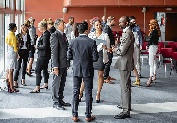 istock Diverse Business Executives Engaging in Discussions at a Conference 2228462015