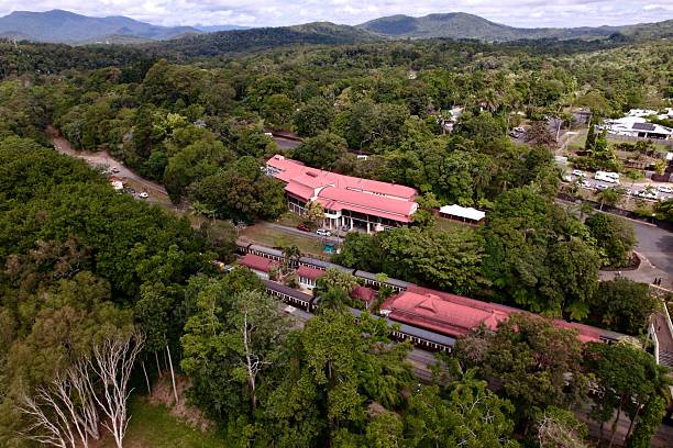 istock Aerial view of forest and red-roofed building complex. 2228462839