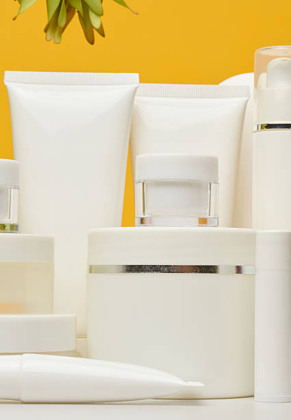 istock Set of white plastic cosmetic packaging without brand on yellow background. Container for beauty industry, skin care and advertising 2228464843