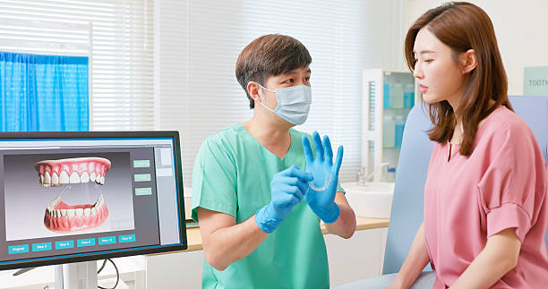 istock asian male dentist introduce transparent braces 2228464895