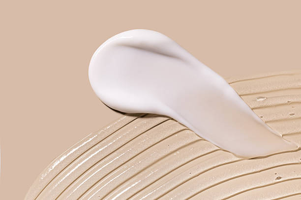 istock glossy cosmetic textures smooth stroke line cream products close-up on beige background 2228467792