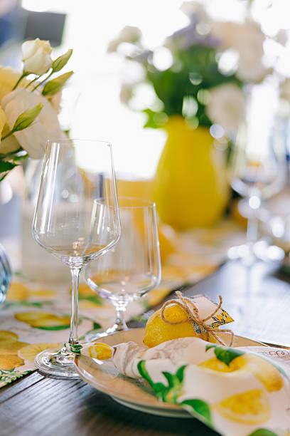 istock Elegant Summer Table Setting with Lemons and Fresh Flowers. 2228467819