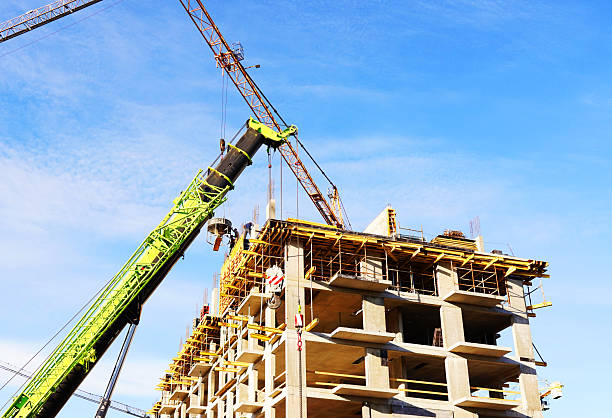 istock Tower crane on apartment Construction. Block House building construction. 2228469915