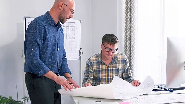 istock The architect and the designer work together on a common project. The two men are coordinating the details of the estimate and the stages of construction 2228470183