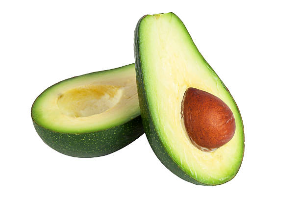 istock Ripe avocado cut in half on white background 2228470354