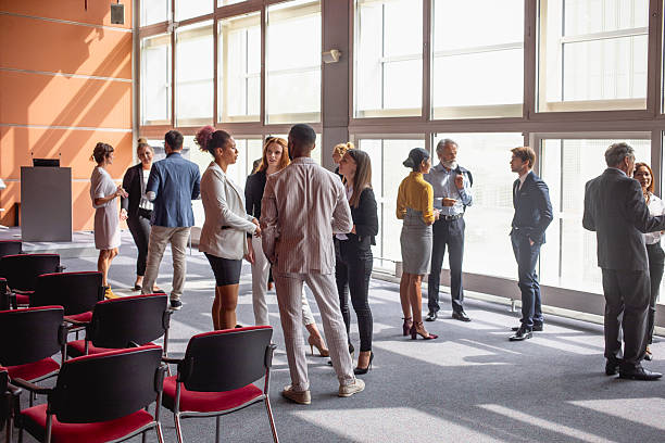 istock Business Executives Engaging in Networking at a Conference 2228472636