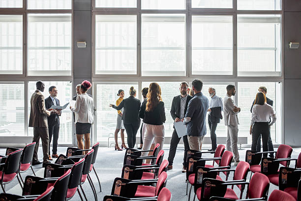 istock Diverse Group of Professionals Networking at Business Conference 2228472655