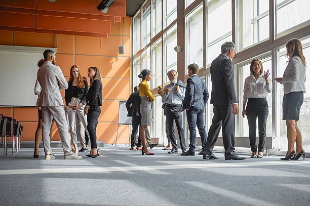 istock Multiracial Group of Business Executives Conversing at a Professional Conference 2228472666