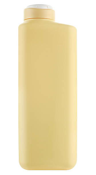 istock Peach plastic shampoo bottle isolated on a white background. Full depth of field. 2228474316