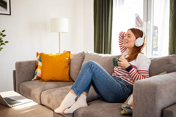 istock Chill Coffee Break with Music for a Young Woman 2228474414
