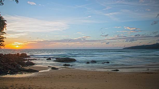 istock Sunset over Kata Beach with rocky shore Phuket 2228474723