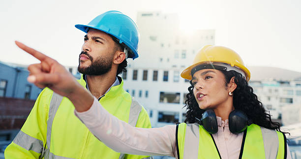 istock Talk, people or builder in city with inspection for architecture project, planning or building. Quality check, pointing or leader on construction site for engineering, teamwork and renovation ideas 2228476362