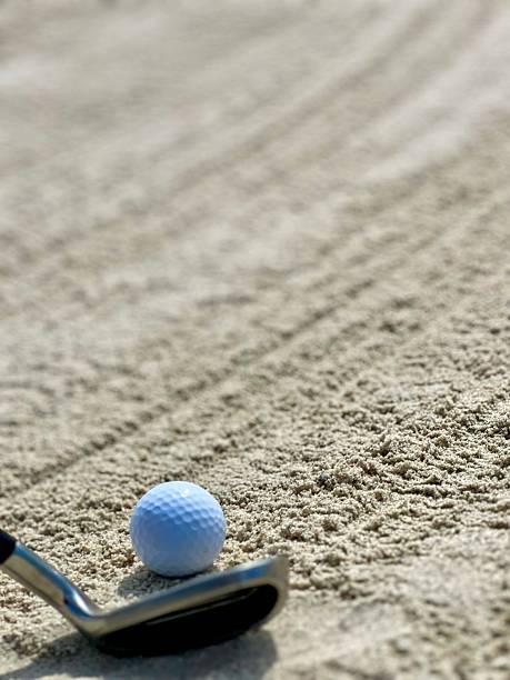 istock Golf Ball in Sand Trap with Wedge – Bunker Shot Setup on Course 2228478733