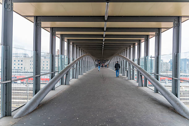 Inside a roofed overhead crossing in Ulm, a city in a state named Baden-Wuerttemberg in southwestern Germany
