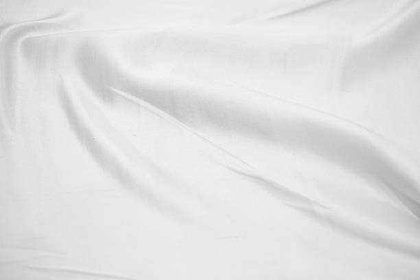 istock Abstract White Bedding Sheets or White wrinkled fabric background texture and Texture with copy-space :Creased or wrinkled white fabric,Soft focus 2228481149