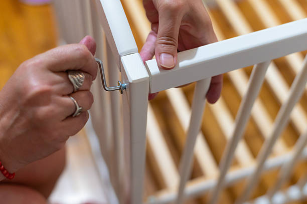 istock Grandmother assembling wooden cradle for her grandchild 2228481173