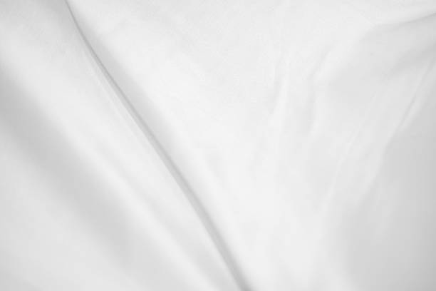 istock Abstract White Bedding Sheets or White wrinkled fabric background texture and Texture with copy-space :Creased or wrinkled white fabric,Soft focus 2228481178
