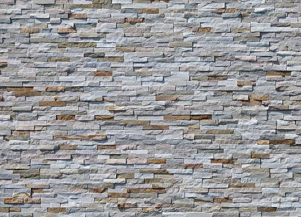 istock External wall coating made of  stone bricks of different colors. 2228482987