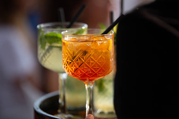 istock A waiter carries orders on a tray at a beach bar. Spritz and other drinks 2228483916