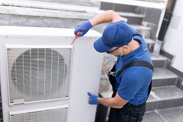 istock Repairman fixing AC outdoor unit. 2228490119
