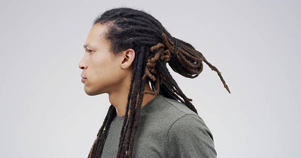 istock Dreadlocks, profile and serious with student man on studio space for college or university education. Development, future and hairstyle with African person isolated on white background for study 2228490282