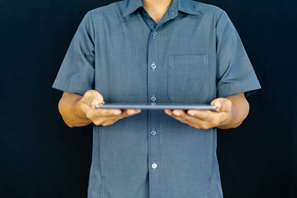 a man in a blue shirt extending his other hand with the palm. This versatile gesture can represent various concepts , making it ideal for business, financial, technological, and conceptual designs.