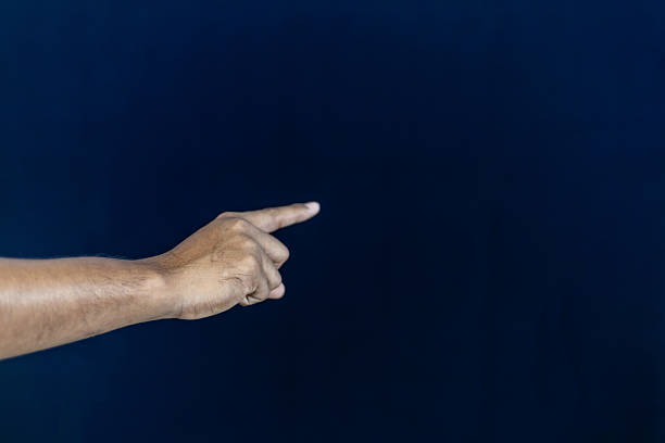 istock a man in a blue shirt extending his other hand with the palm. This versatile gesture can represent various concepts , making it ideal for business, financial, technological, and conceptual designs. 2228491254