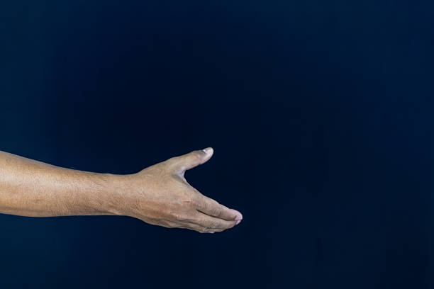 a man in a blue shirt extending his other hand with the palm. This versatile gesture can represent various concepts , making it ideal for business, financial, technological, and conceptual designs.