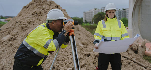 istock Construction engineers are discussing and using machinery and macros for large-scale construction projects. 2228492747