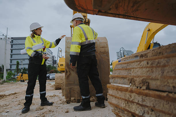 istock Construction engineers are discussing and using machinery and macros for large-scale construction projects. 2228492835